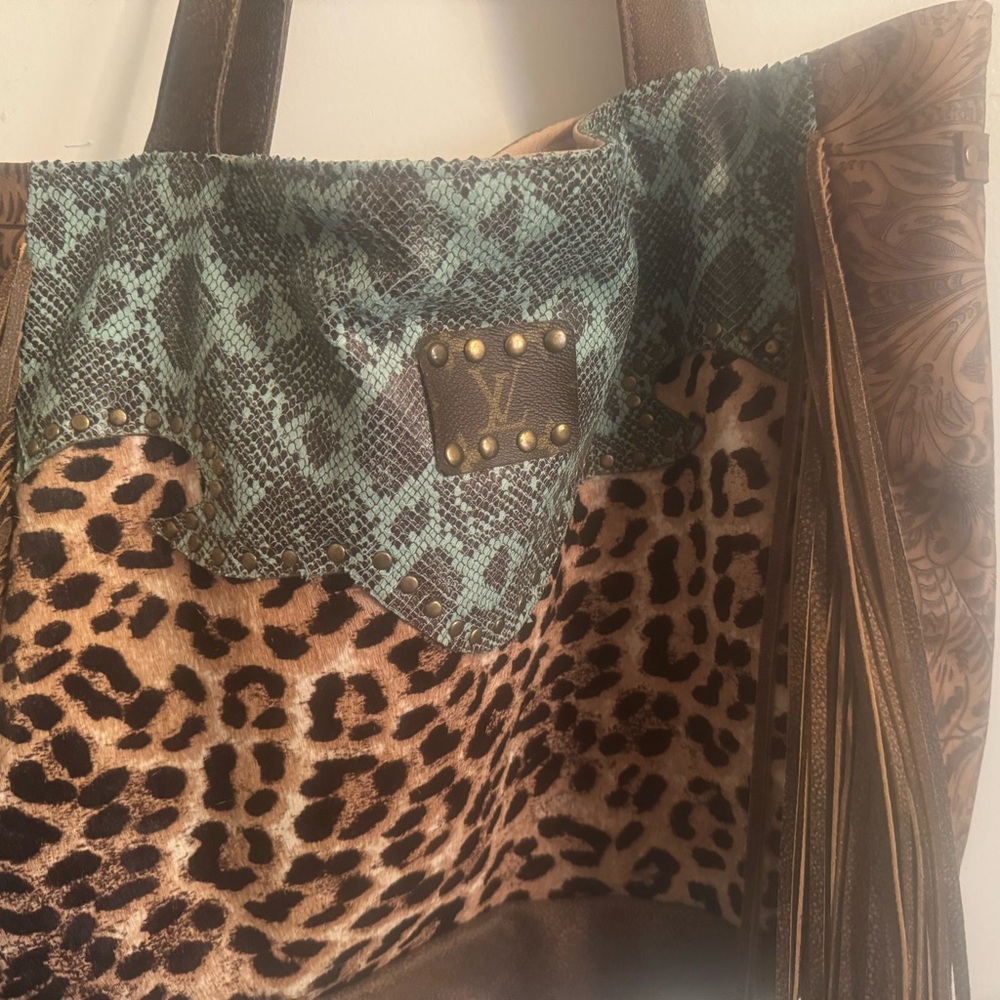 Gorgeous real  leather tote with fringe on sides!